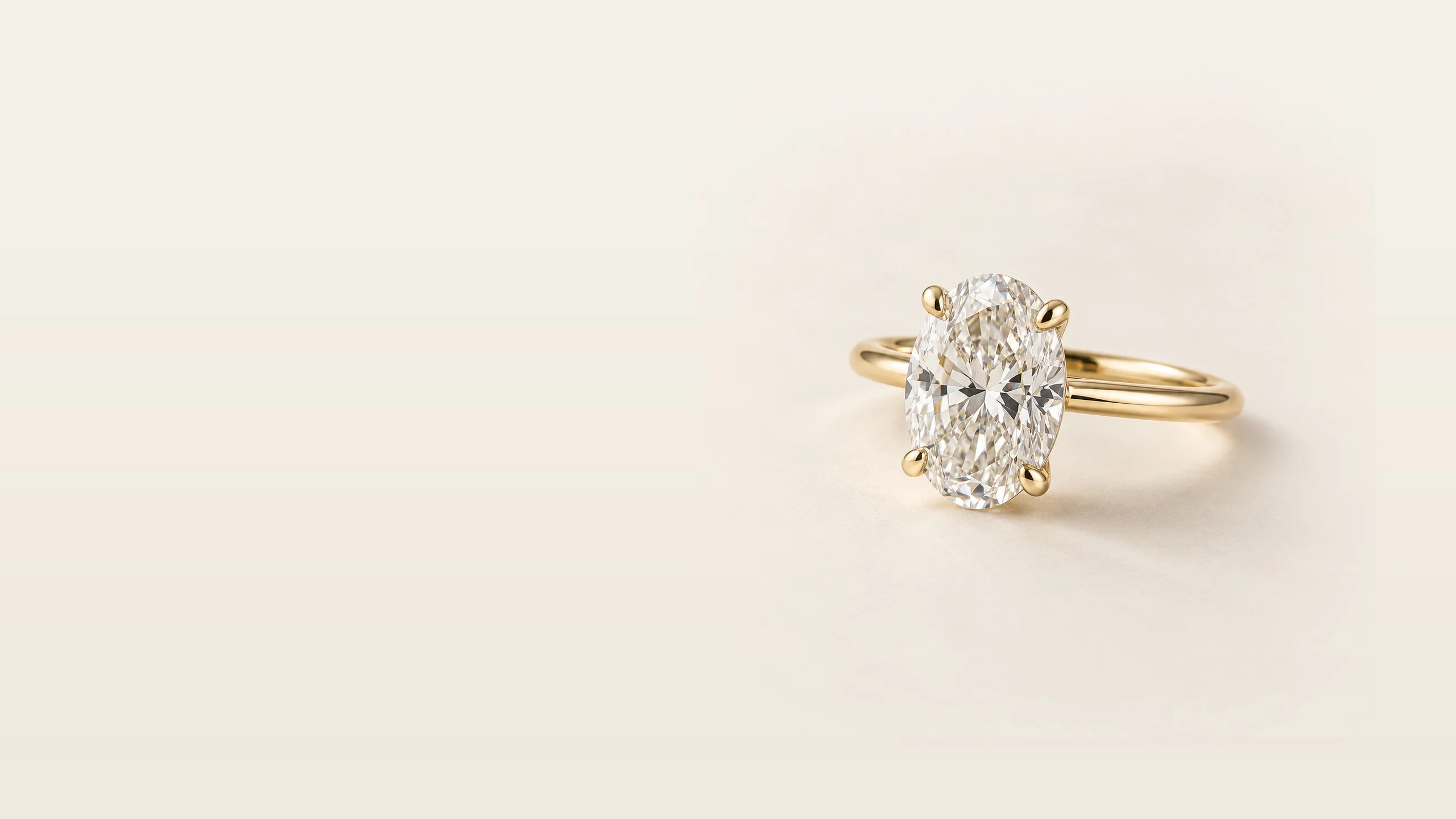 Oval Lab-Grown Diamond ring in soft natural light on an ivory surface